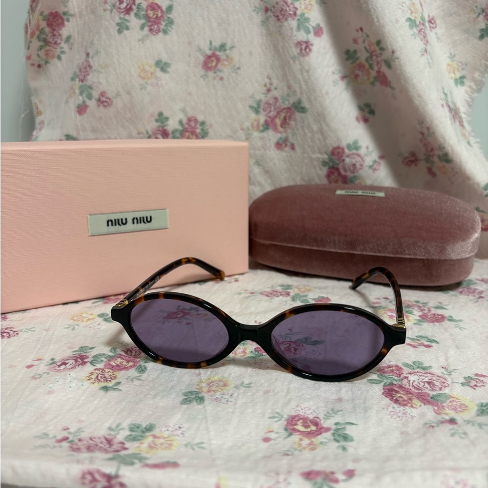 Miu Niu vintage oval sunglasses.